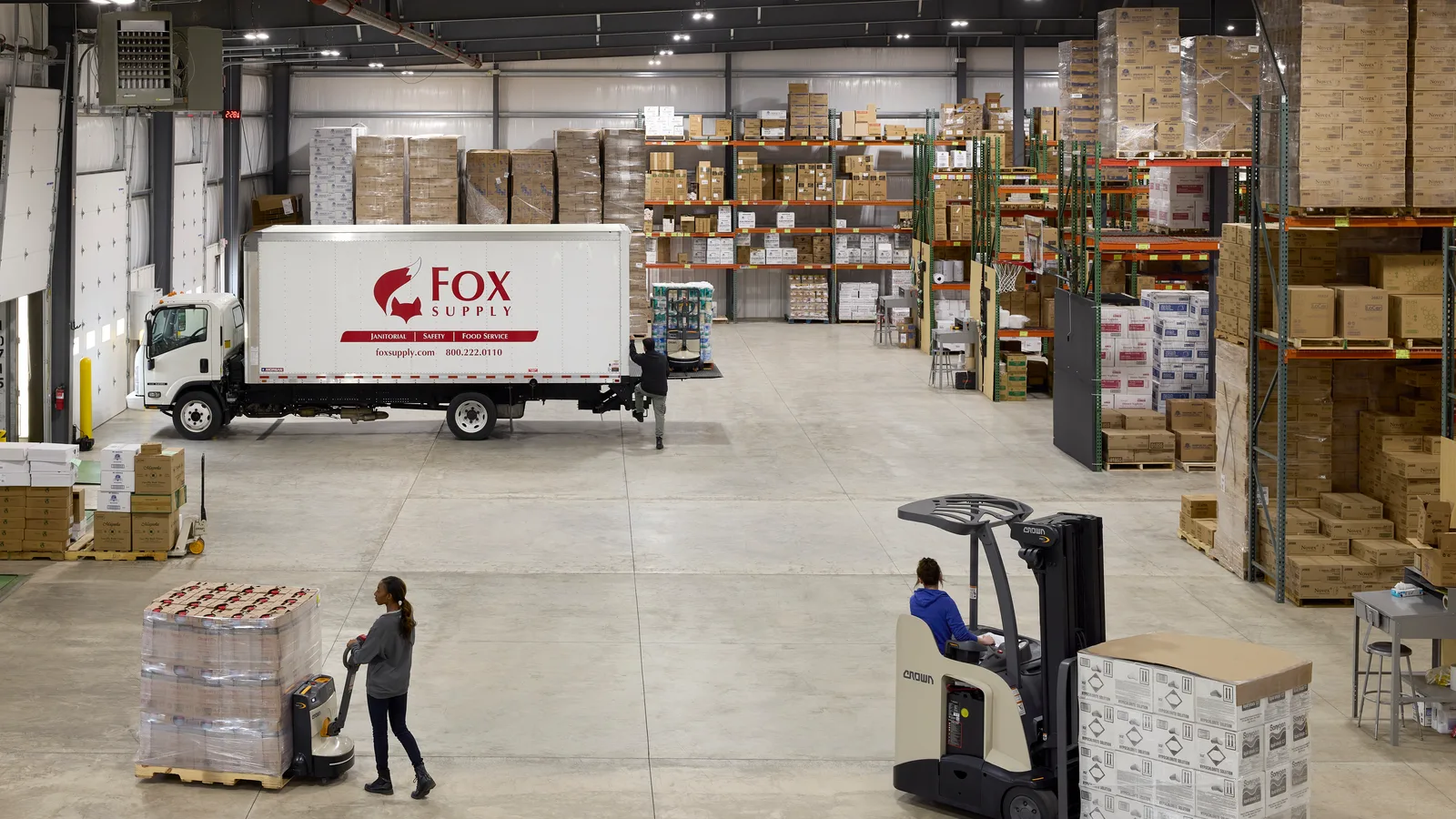 Crown electric forklift working a distribution warehouse
